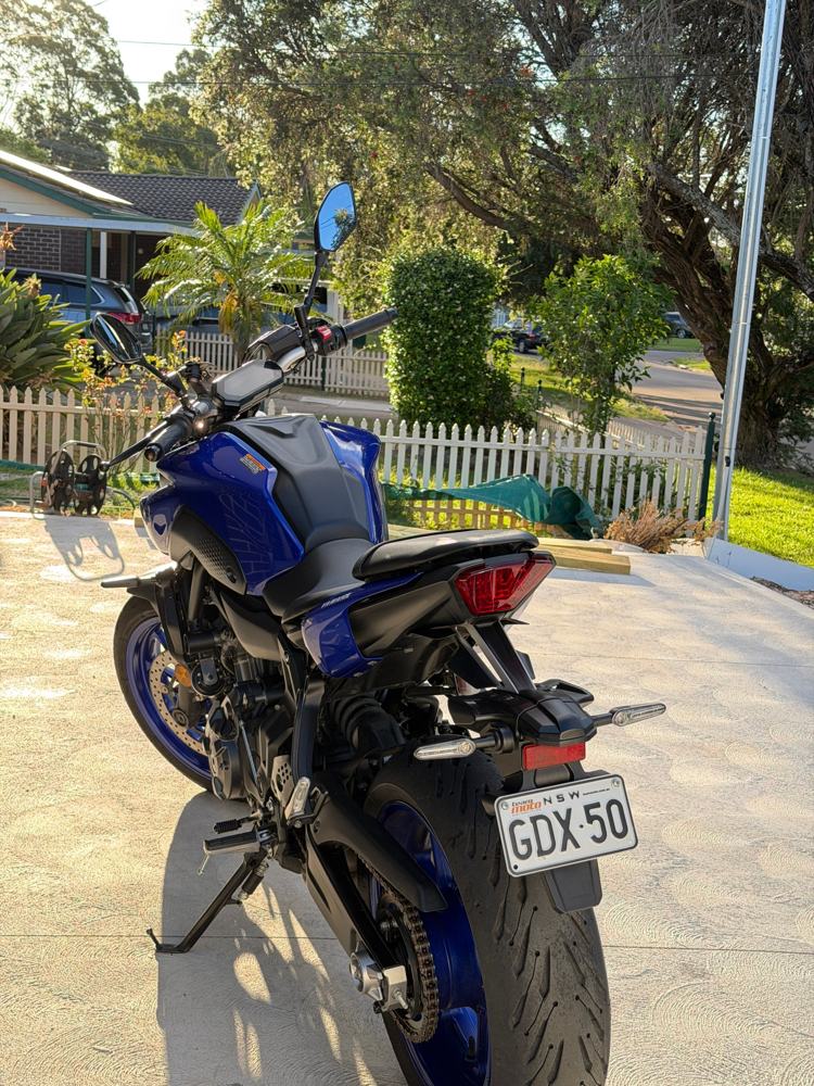 Motorbike detail result: a blue Yamaha naked bike after a clean