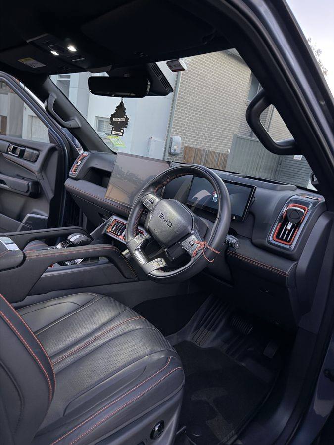 Interior detail result: cleaned dashboard and leather seats
